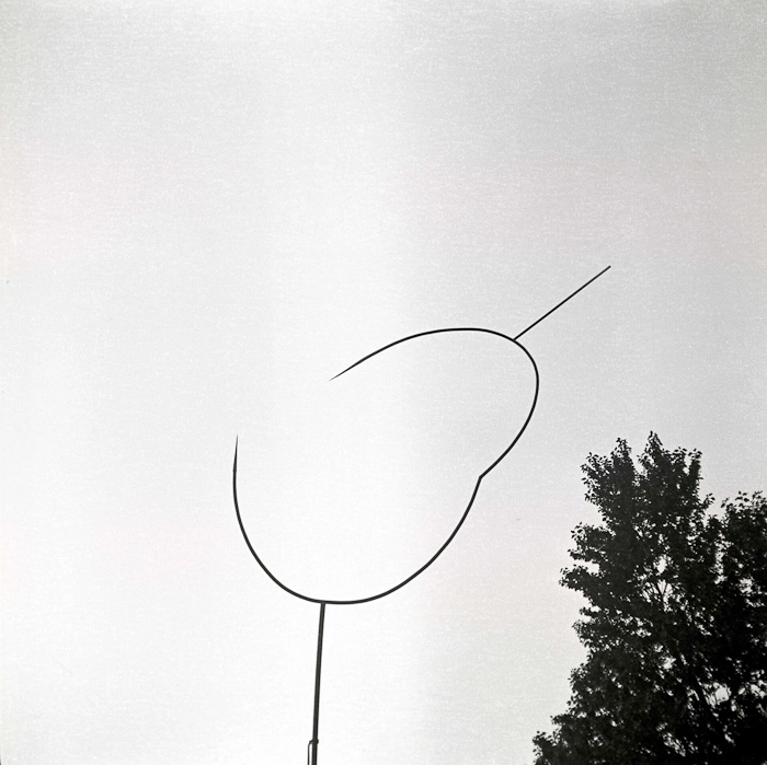 Elblag, 1965, a work by Edawrd Krasinski. Krasinski designed the sculpture as a vertical, approximately 6-meter tall, telescopically tapering pipe with a burst circle connected to the top. Today it can be seen in the southwestern part of the EL Gallery's courtyard.