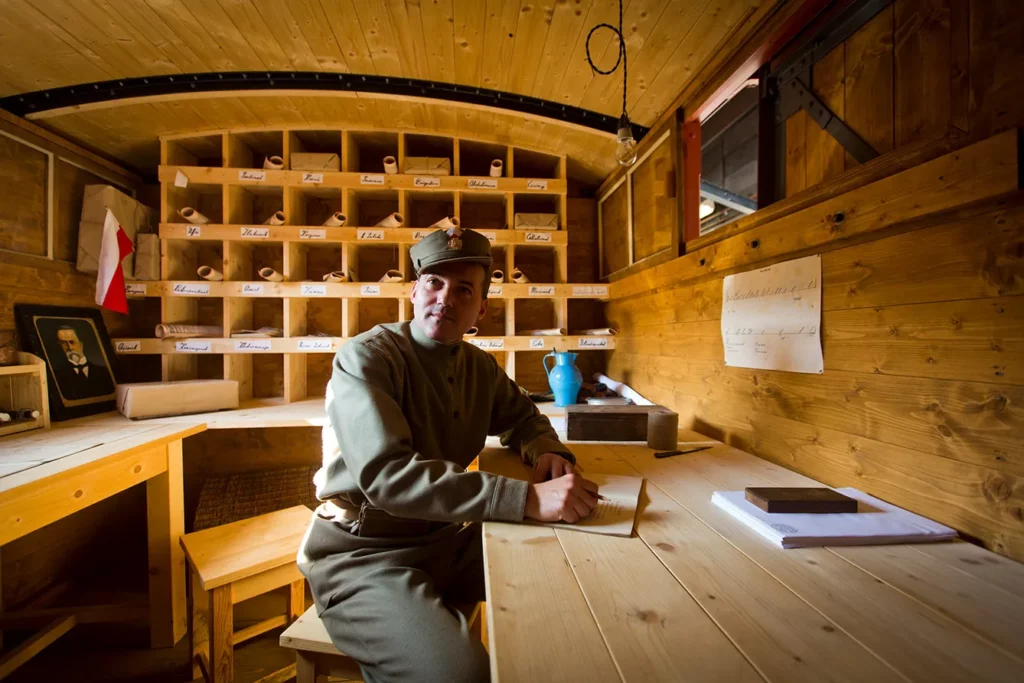 Enthusiasts Reenact World War I Train Deployment. An enthusiast dressed in WWI Czechoslovak Legion uniform poses in post car during the presentation of the replica train which transported volunteers of the Czechoslovak Legion into Russia during WWI on October 9, 2014 in Prague, Czech Republic. Czechoslovak legionnaires community have built and renovated seven wagons of the legionaries' train which were created 100 years ago.