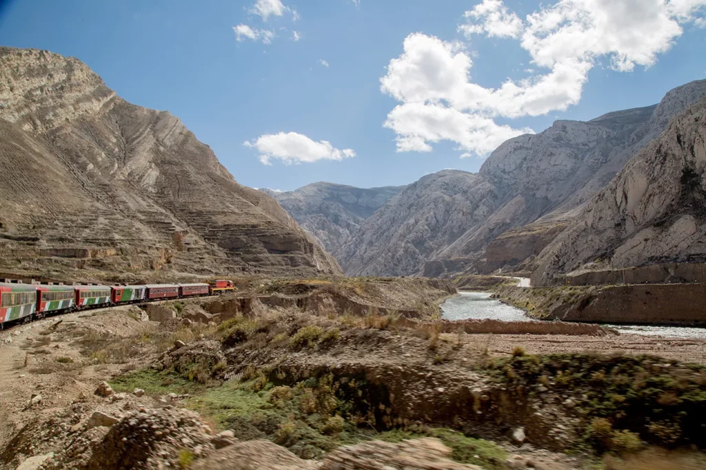 The Central Andean Railroad. LIMA, PERU - JULY 1: View of the train and landscape during a trip in the world famous Railroad 'Ferrocarril Central Andino' on July 1, 2018 in Lima, Peru. The Ferrocarril Central Andino crosses the highest railway point in America and second in the world, crossing a height of 4782 msn in the Peruvian Andes.