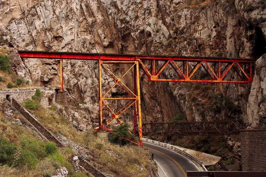 INFIERNILLO, SAN MATEO DE HUANCHOR, HUAROCHIRI, PERU - 2017/08/22: Railway bridge of the Peruvian central Andean railroad at the "Infiernillo".
