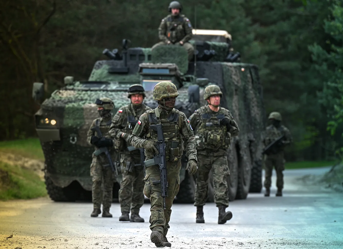 NOWA DEBA, POLAND - May 6, 2023: Polish soldiers seen before a high-intensity training session using M1A2 Abrams tanks at Nowa Deba training ground, on May 6, 2023, in Nowa Deba, Poland. The Anakonda-23 exercise kicks off in Nowa Deba, marking the pinnacle of the Polish Army's training calendar this year. From F-16 aircraft to W-3 SOKOL helicopters, GROM missile systems, RAK self-propelled mortars, KRAB howitzers, SPIKE anti-tank guided missiles, and LANGUSTA launchers, soldiers from various units in the Polish Army, along with counterparts from the United States, Romania, and Slovenia, will come together to train and collaborate towards achieving military excellence.