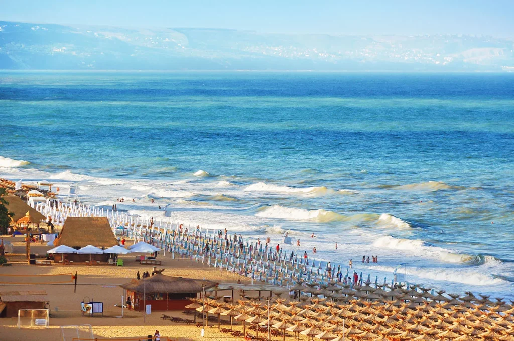 Resort Golden Sands Bulgaria panorama of the beach and the sea shore with beautiful waves with white foam. Panoramic view Golden Sands Bulgaria.