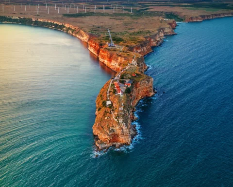 Aerial sunset view over cape Kaliakra with windmills farm, huge cliffs on black sea coast in Bulgaria.