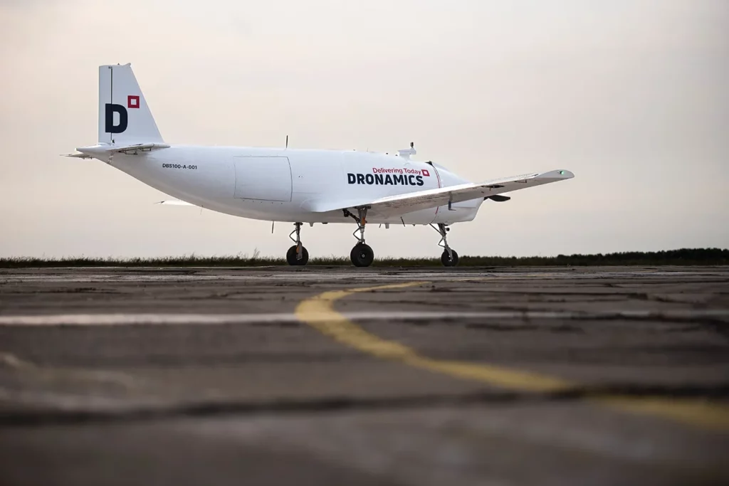 View from the right against the background of the runway and sky.