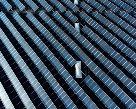 tacked solar panels on a commercial building aerial photo