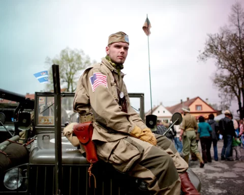 Enthusiasts Commemorate Liberation Of West Bohemia During World War II. DNESICE, CZECH REPUBLIC - MAY 04: A history enthusiast dressed in WWII U.S. Army uniform poses during stop over the 'Convoy of Liberty' event which drive through west Bohemian cities and villages near Pilsen on. May 4, 2013 in Dnesice, Czech Republic. 'Convoy of Liberty' commemorates the 68th anniversary of the World War II ending in Europe and when in 1945 the western part of the Czech Republic was liberated by the U.S. Army from Nazi oppression.