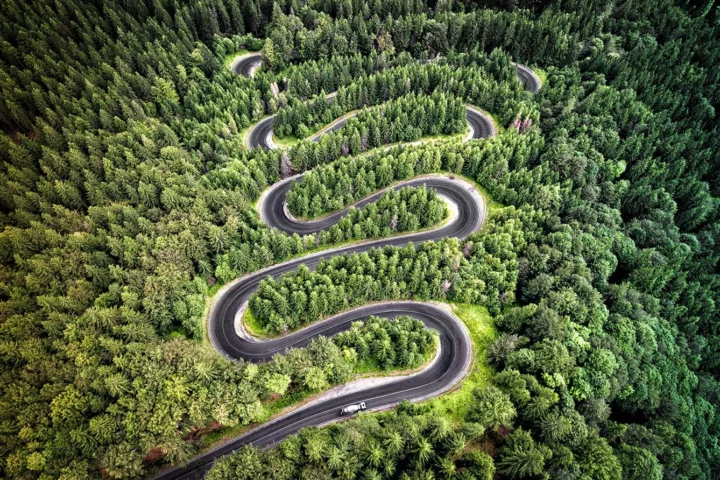Curvy road from the high mountain pass in Transalpina, Romania.