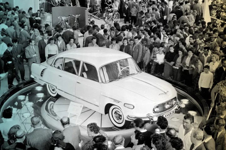 to the First International Trade Fair at Brno, admire a Czech-made "Tatra -603" car on show in one of the three large engineering exhibitions.