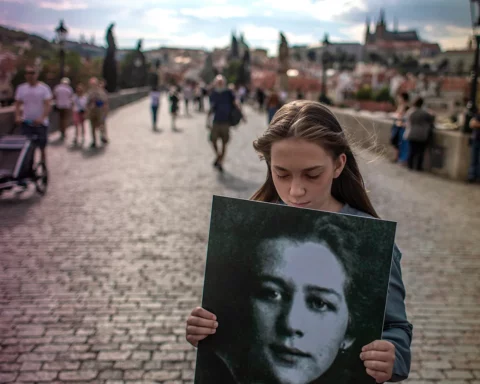 A student holds a placard with a portrait of Milada Horakova while commemorating the 70th anniversary of her execution, on Charles Bridge in Prague, Czech Republic, 25 June 2020. Horakova, a Czech lawyer and politician who opposed the single-party communist system, was the victim of judicial murder during the communist political show trials in the 1950s. She was convicted on fabricated charges of conspiracy and treason and executed on 27 June 1950.