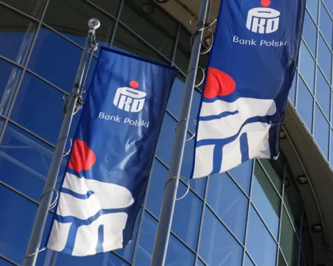 Flags in front of the headquarters of PKO Bank Polski.