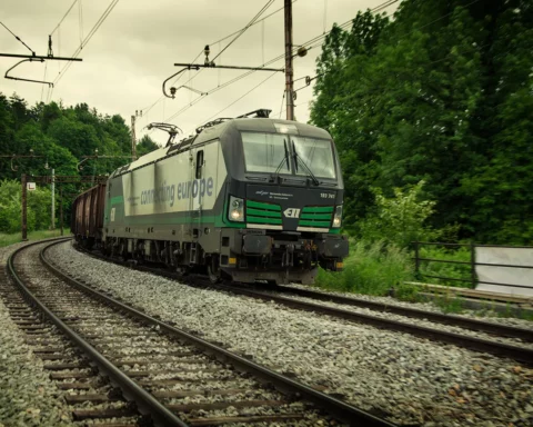 Euro train locomotive is pulling heavy loaded train to destination sea port Koper.