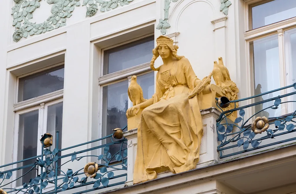 Charles Street, Prague, Czech Republic, a house decorated with the Art Nouveau statue of the legendary Princess Libuse surrounded by roses.
