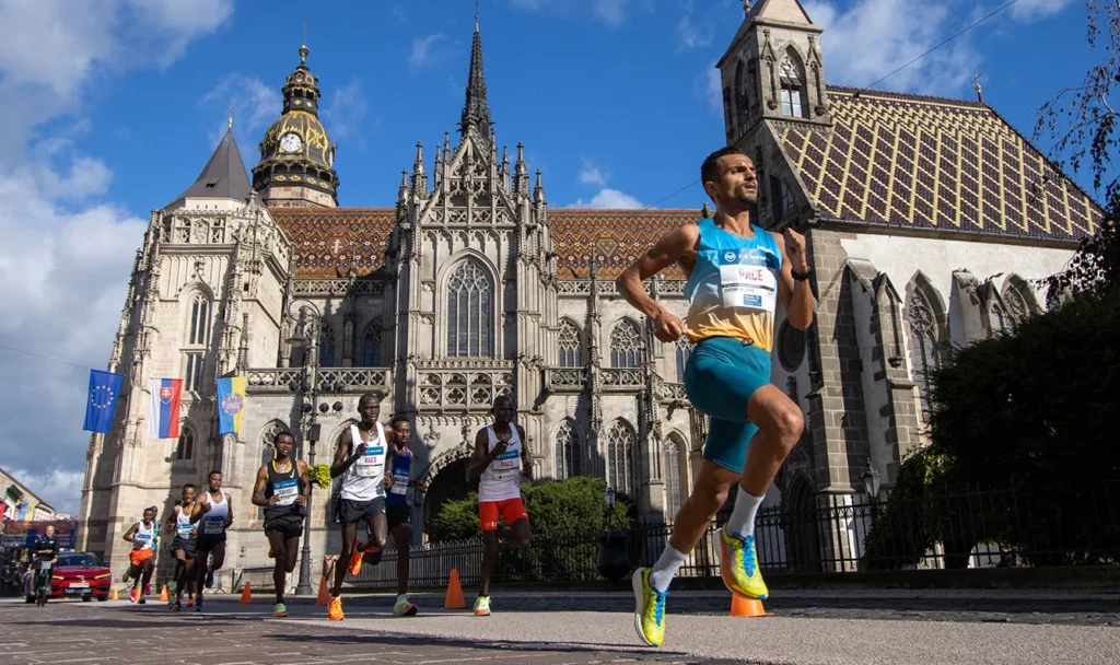 Marathon participants run past Saint Elizabeth's Cathedral.