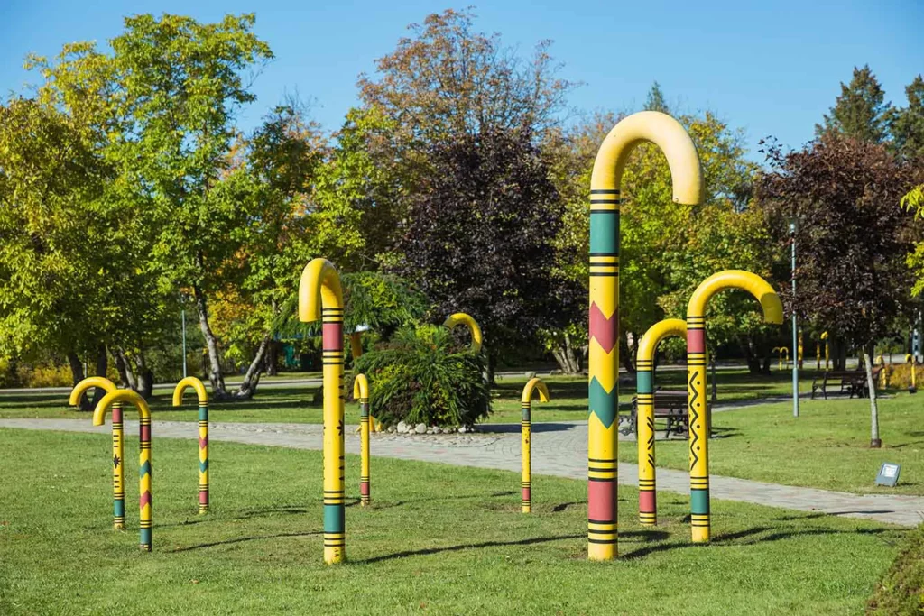 City Sigulda, Latvia. City symbol - walking stick and green park.