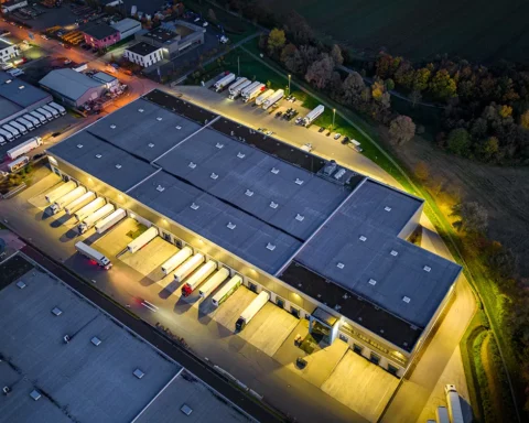 Distribution warehouse at dusk - aerial view.