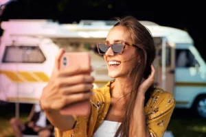 Young caucasian woman taking selfie in the summer on camping in Poland