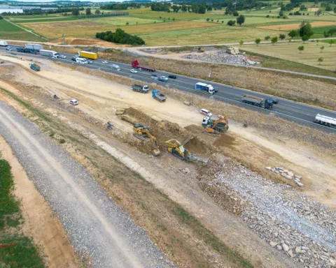 Motorway construction site with construction vehicles and machines, new construction and renovation of the A8 near Pforzheim, drone recording.