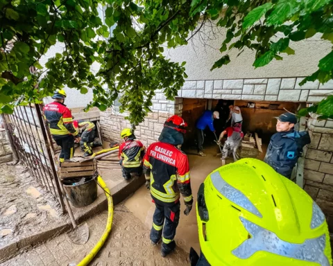 Nozice, Slovenia - August 5, 2023: Voluntary fire brigade from Lukovica town helping residents of Nozice village pumping water after severe flood.