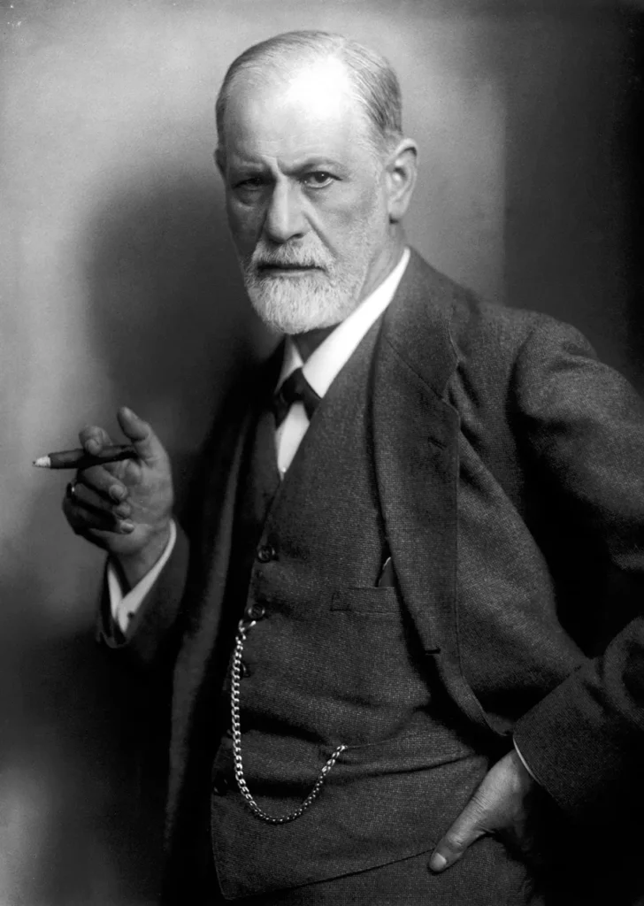 Sigmund Freud, founder of psychoanalysis, holding a cigar. Photographed by his son-in-law, Max Halberstadt, c. 1921.