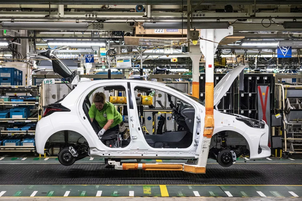 Automobile Production at Toyota Motor Manufacturing Czech Republic s.r.o. A worker installs components into a Yaris automobile on the production line at the Toyota Motor Manufacturing Czech Republic s.r.o. plant in Kolin, Czech Republic.