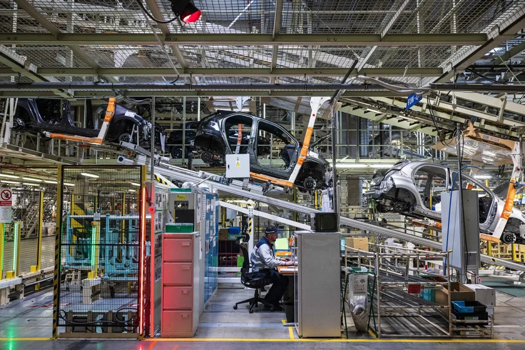 Automobile Production at Toyota Motor Manufacturing Czech Republic s.r.o. A worker at a desk alongside automobiles moving along the production line at the Toyota Motor Manufacturing Czech Republic s.r.o. plant in Kolin, Czech Republic.