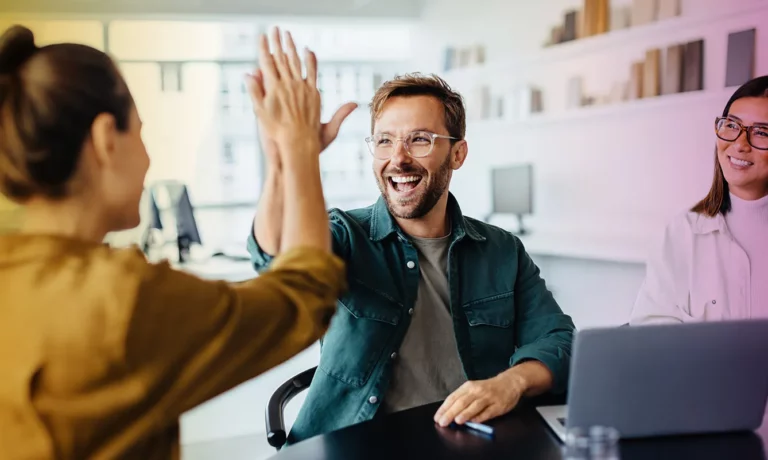 Business people celebrating success in an office