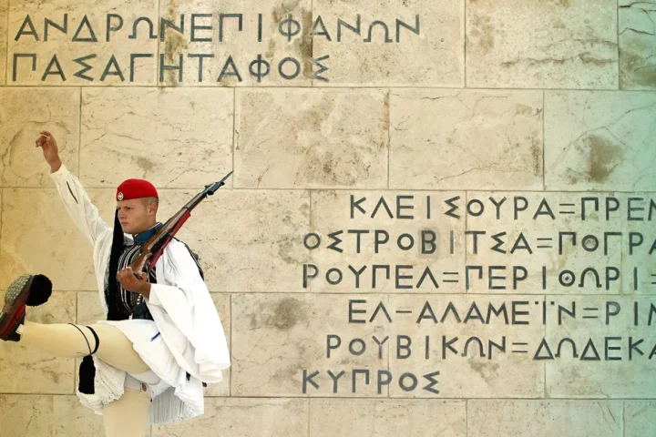 An Evzone marches during the changing-of-the-guard ceremony outside the parliament building in Athens, Greece.