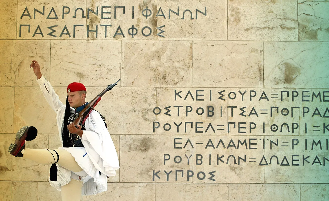 An Evzone marches during the changing-of-the-guard ceremony outside the parliament building in Athens, Greece.