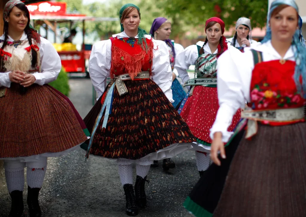 Women dressed in traditional "Gailtaler" costumes participate in village celebrations in Feistritz an der Gail, in the Austrian province of Carinthia, May 28, 2012. The annual celebrations are centered around an alpine farming custom called "Kufenstechen" which, according to the first written records, dates back to 1630. In turn the unmarried young men ride bareback on Noriker horses, beating a wooden barrel with an iron club until the last wooden splinter has fallen down, followed by a dance "under the lime trees" with the unmarried women wearing traditional "Gailtaler" costumes.