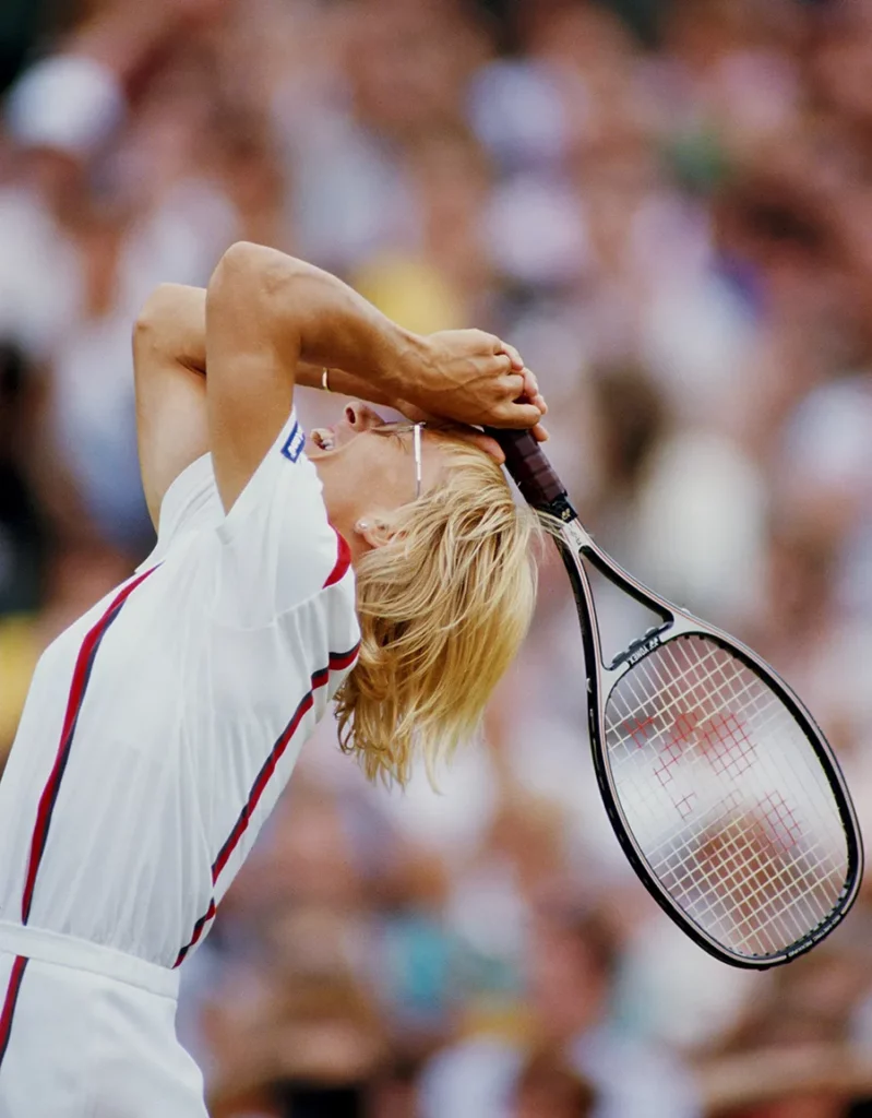 Martina Navratilova of the United States celebrates winning the Women's Singles Final match against Steffi Graf at the Wimbledon Lawn Tennis Championship on 4 July 1987 at the All England Lawn Tennis and Croquet Club in Wimbledon in London, England.