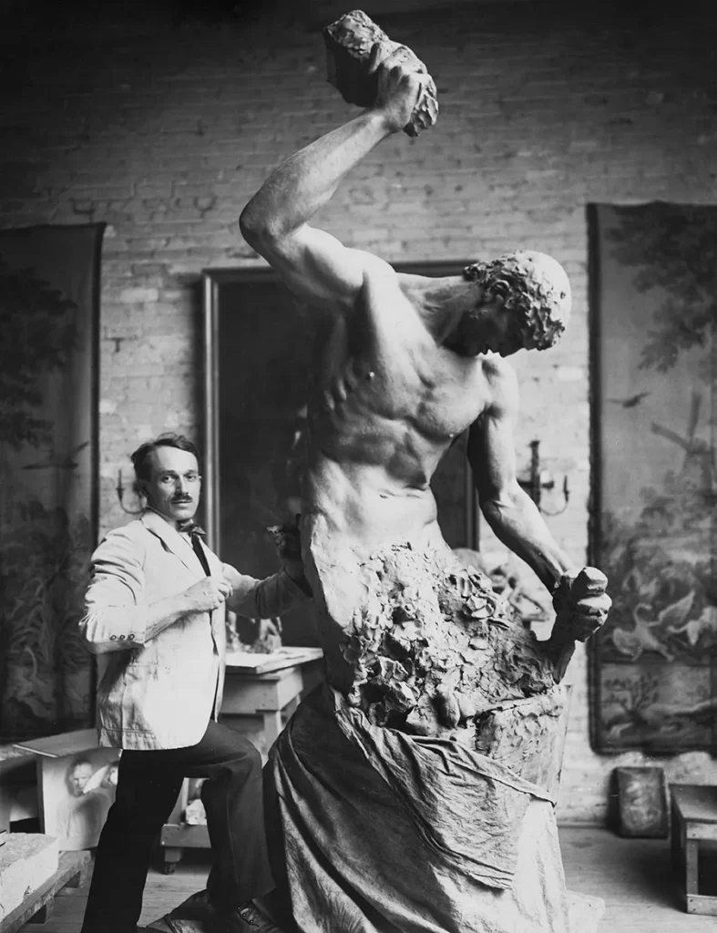 Albin Polasek with his sculpture 'Man Carv­ing His Own Des­tiny', circa 1910.